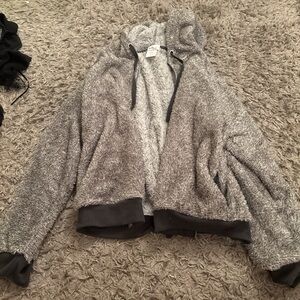 Grey and black fluffy zip up jacket #jacket